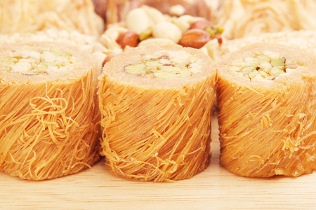 different oriental sweets baklava on wooden tableの写真素材