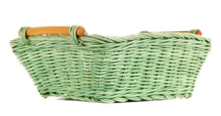 green wooden basket, isolated on white backgroundの写真素材