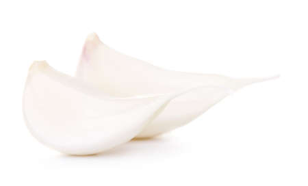 fresh garlic cloves, isolated on white backgroundの写真素材