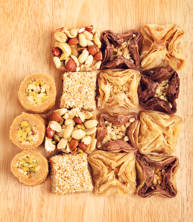 different oriental sweets baklava on wooden tableの写真素材
