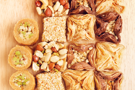 different oriental sweets baklava on wooden tableの写真素材