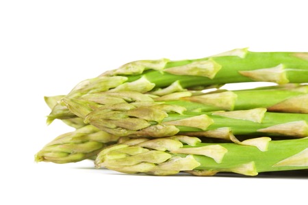 bunch of fresh green asparagus, isolated on whiteの写真素材