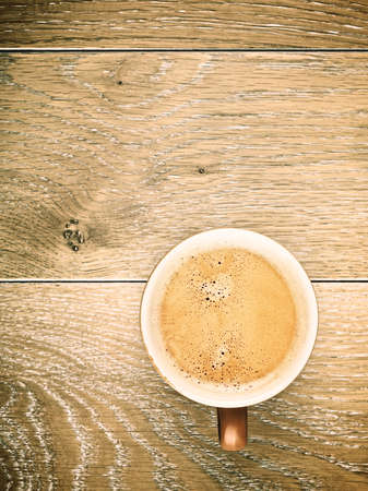 cup of espresso coffee on wooden tableの写真素材