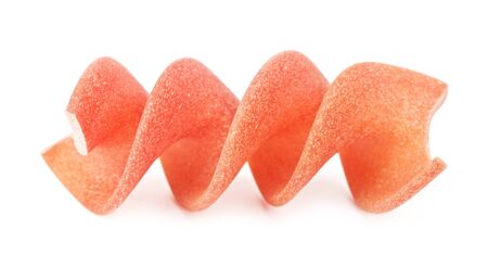 raw red spiral pasta fusilli, isolated on whiteの写真素材
