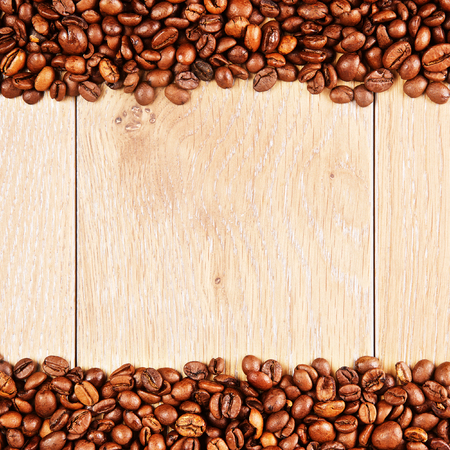 roasted coffee beans on wooden table, backgroundの写真素材