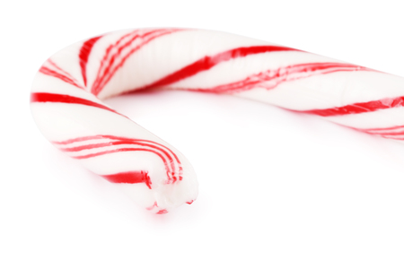 striped mint hard candy cane, isolated on white backgroundの写真素材