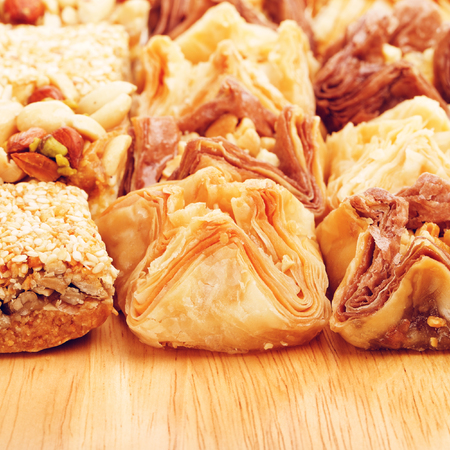 different oriental sweets baklava on wooden tableの写真素材