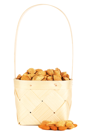 almonds nuts in wooden, isolated on white backgroundの写真素材