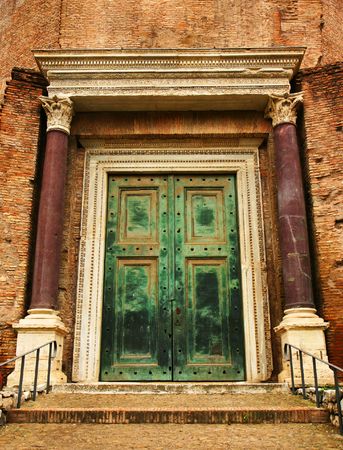 Ancient green bronze door with columnsの写真素材
