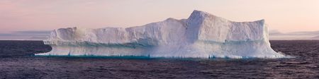 Large iceberg floating in sea. Horizontally framed shot.の写真素材