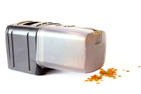 Automatic Fish Feeder with Spilled Foodの写真素材