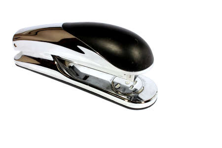 Isolated chrome and black stapler used for binding things together  