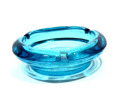 Isolated blue glass ash tray used by smokers の写真素材