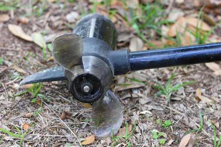 Close up view of a boat motor propeller