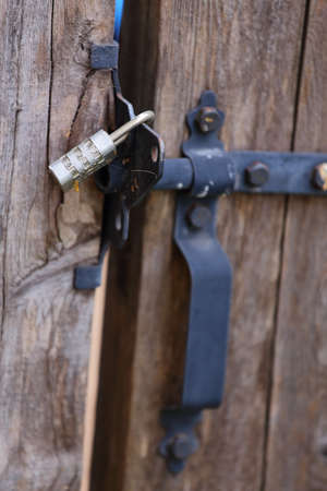 Close up view of a locked gate handle