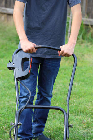 Close up view of someone mowing the lawnの写真素材