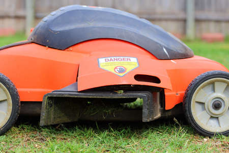 Close up view of someone mowing the lawnの写真素材