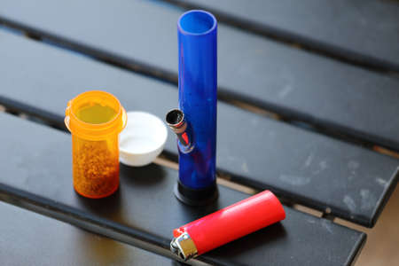Everything you need for medicinal marijuana including a lighter, bong, and medicinal marijuanaの写真素材