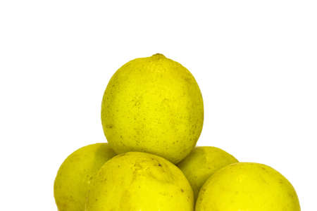 Group of ripe whole yellow lemon citrus fruit isolated on white backgroundの写真素材