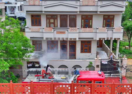 Jaipur,India-Circa 2020: Picture of Sanitization of houses using fire trucksのeditorial素材