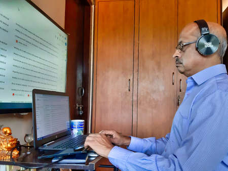 Jaipur,India-Circa 2020: Picture of a person doing office work from home