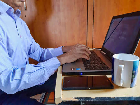 Jaipur,India-Circa 2020: Picture of a person doing office work from home