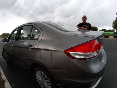 Jaipur,India-Circa 2020: Picture of a person with his sedan out for a drive on a cloudy dayのeditorial素材
