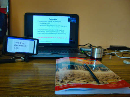 Jaipur,India-Circa 2020: Picture of Laptop, Mobile phone and a notebook kept on a table. Students...