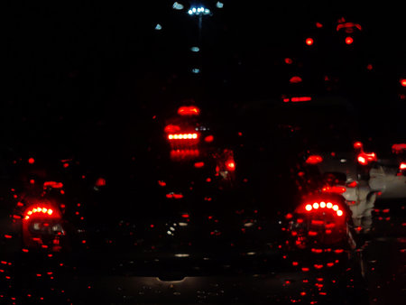 Red color backlights of a vehicle with black backgroundの写真素材