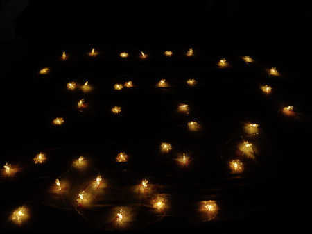 Picture of yellow colored lights shot against dark backgroundの写真素材