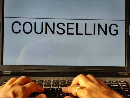 Picture of a person searching for counselling procedure on an entrance exam on a laptop. Counselling is written on screen.の写真素材