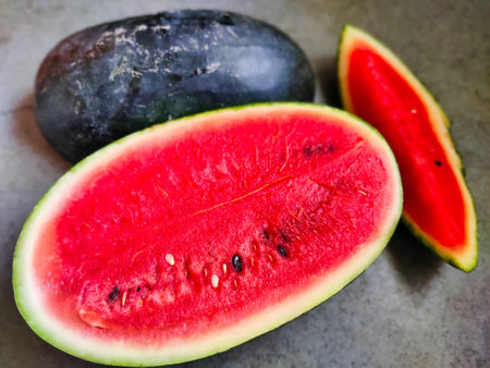 Picture of red slices of watermelon fruit cut shot during daylight in summers. Watermelon is rich in vitamins.の写真素材