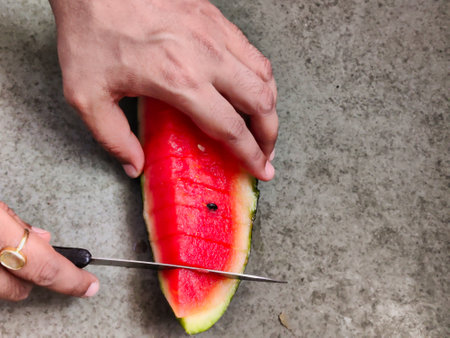 Picture of red slices of watermelon fruit cut shot during daylight in summers. Watermelon is rich in vitamins.の写真素材