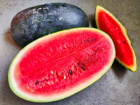 Picture of red slices of watermelon fruit cut shot during daylight in summers. Watermelon is rich in vitamins.の写真素材