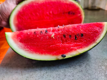 Picture of red slices of watermelon fruit cut shot during daylight in summers. Watermelon is rich in vitamins.の写真素材