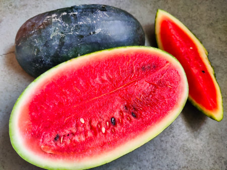 Picture of red slices of watermelon fruit cut shot during daylight in summers. Watermelon is rich in vitamins.の写真素材