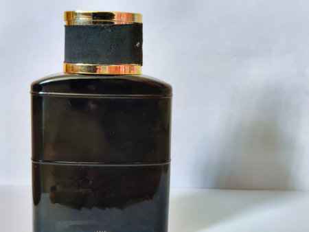 Black perfume bottle isolated on a white background. Close-up.の写真素材