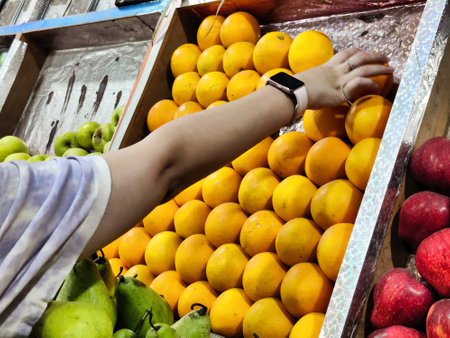 Picture of a person buying fresh fruits from a fruit shop. Healthy Diet foodの写真素材