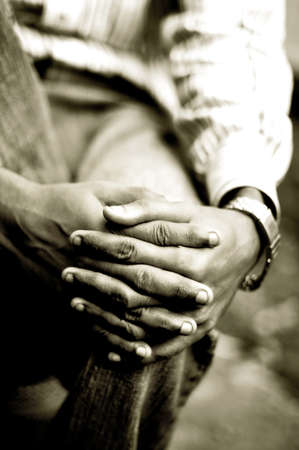 Closeup of man with folded fingersの写真素材