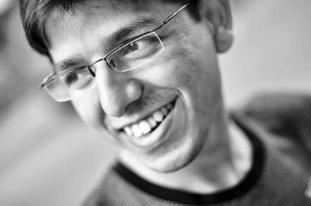 Black and white portrait of young male smilingの写真素材