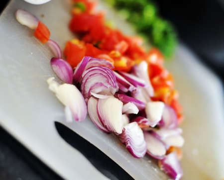 Fresh cut vegetables on chopping boardの写真素材