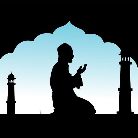 silhouette of human offering prayers at mosque の写真素材