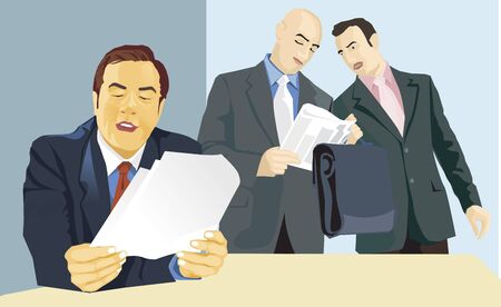 Three business people reading newspaperの写真素材