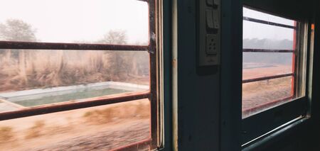 Outside view from window inside the Indian railways train.の写真素材