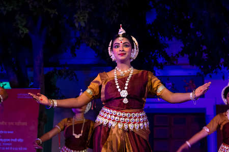 PUSHKAR, RAJASTHAN / INDIA  NOVEMBER 2019 : Young girls performing Indian classical Odissi dance in...