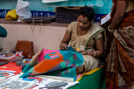 New Delhi, India, November 2019 : An artist making craft products in Dilli Haat for sale.のeditorial素材