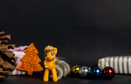 Christmas celebration, Christmas gifts and tree with toys and christmas balls isolated on black background. Christmas theme greetings concept.の写真素材