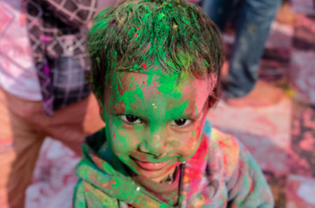 BARSANA, UTTAR PRADESH / INDIA - MARCH 2020: People celebrate the traditional and a ritualistic colorful Lathmar Holi with dance and colored faces at Radharani templeのeditorial素材