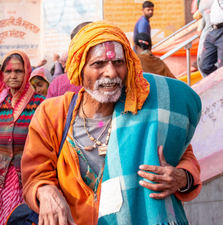 BARSANA, UTTAR PRADESH / INDIA - MARCH 2020: People celebrate the traditional and a ritualistic colorful Lathmar Holi with dance and colored faces at Radharani templeのeditorial素材