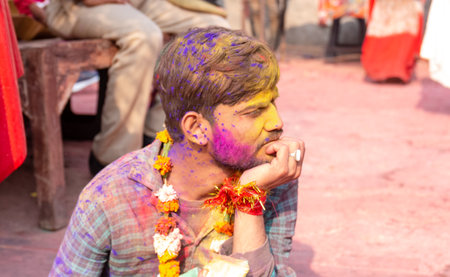 BARSANA, UTTAR PRADESH / INDIA - MARCH 2020: People celebrate the traditional and a ritualistic...